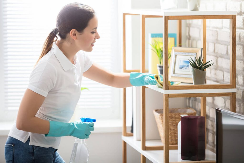 Person Cleaning Shelf - Cleanhome York